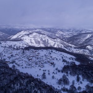 Kotyli Vilage at 1450 meters above sea level at winter with snow aerial view