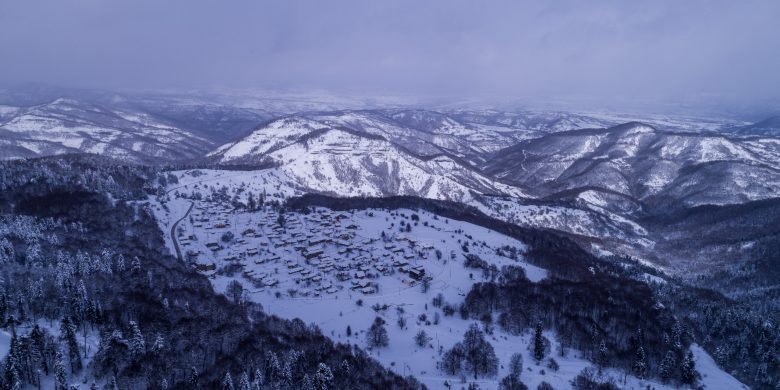 Kotyli Vilage at 1450 meters above sea level at winter with snow aerial view