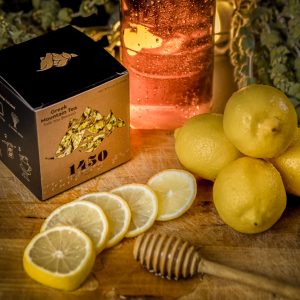 1450 beautyshot with tea package lemons and tea blossoms on the table