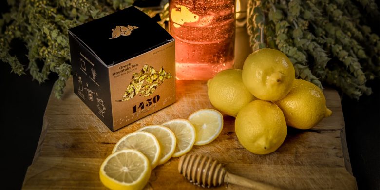 1450 beautyshot with tea package lemons and tea blossoms on the table